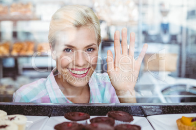 Pretty woman gesturing a greeting