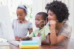 Happy family using the computer