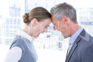 Head to head business colleagues quarreling