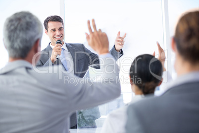 Businessman explaining the graph on the whiteboard