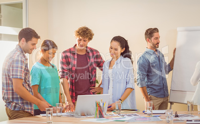 Happy team looking at their work