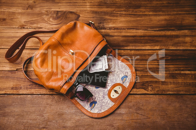 Sunglasses and wallet on the vintage bag
