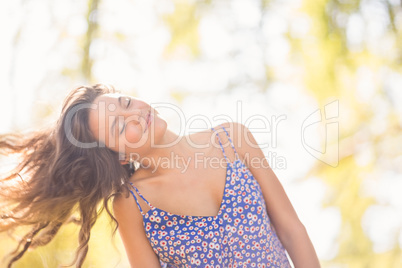 Pretty brunette tossing her hairs