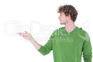 Handsome man holding something in front of camera