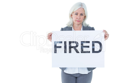 Businesswoman holding sign in front of her