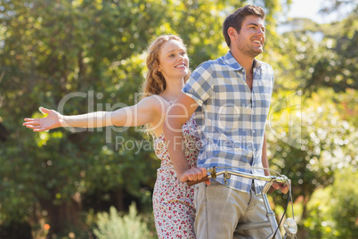 Young couple on a bike ride in the park