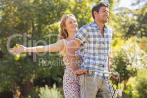 Young couple on a bike ride in the park