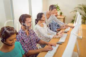 Manager assisting staffs in call center