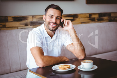 Young man smiling on the phone