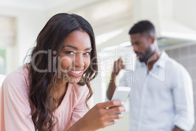Pretty woman using her smartphone