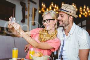 Hipster couple taking a selfie