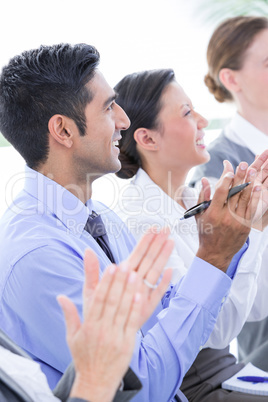 Business team looking at white screen