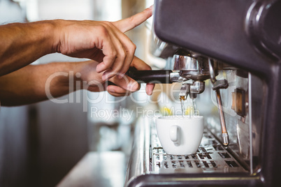 happy worker making coffee