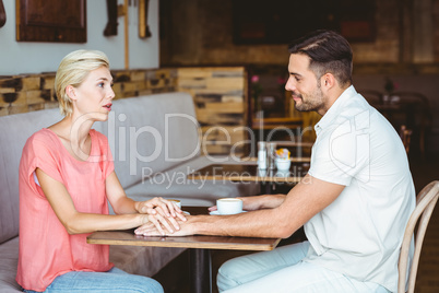 Cute couple on a date holding hands