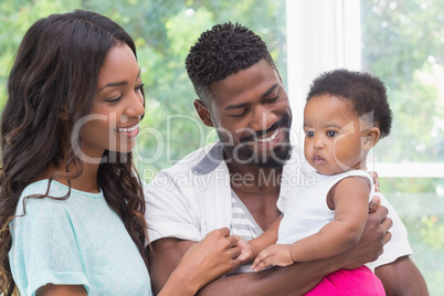 Happy parents with baby girl