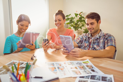 Creative colleagues with digital tablet