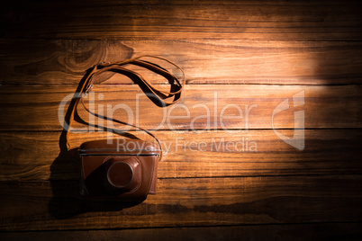 A camera on the wooden table