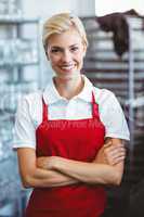 Pretty barista smiling at the camera