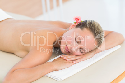 Peaceful blonde lying on towel