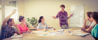 Casual businessman giving presentation to his colleagues