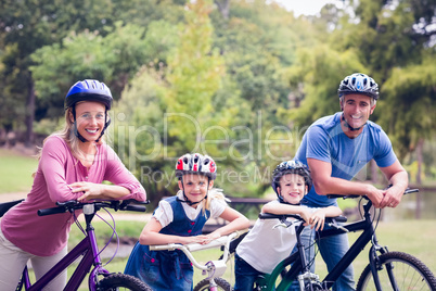 Happy family on their bike at the park