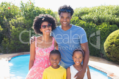 Happy family smiling at camera