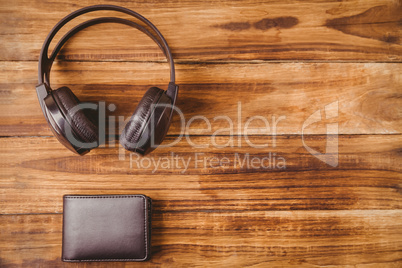 Music headphone next to wallet
