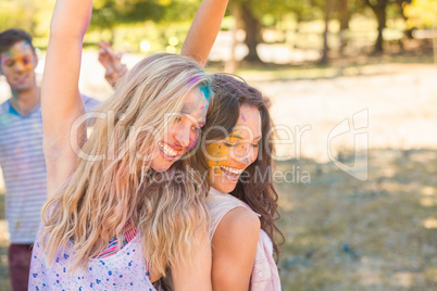 Young women having fun with powder paint