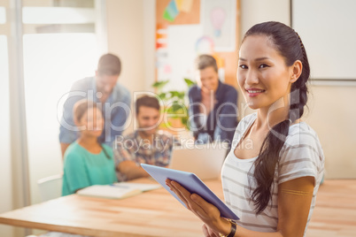 Businesswoman using tablet in the office