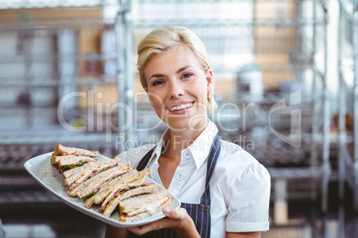 Selfassured female waitress smiling