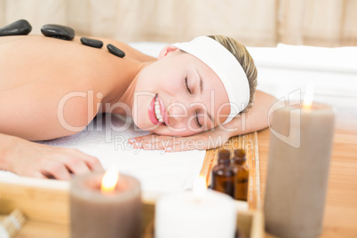 Beautiful blonde enjoying a hot stone massage