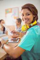 Smiling businesswoman with headphones in a meeting