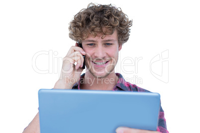 Happy handsome man holding tablet computer and having a phone ca