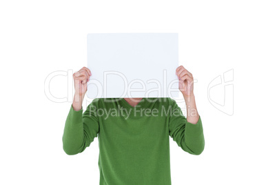 Casual man hiding his head with blank paper