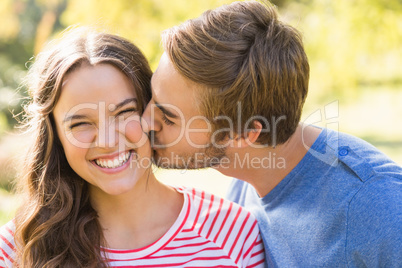 Cute couple kissing in the park