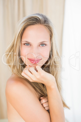 Pretty blonde sitting on massage table