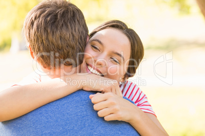 Cute couple hugging in the park