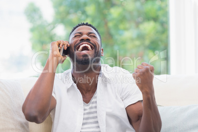 Excited man on the phone