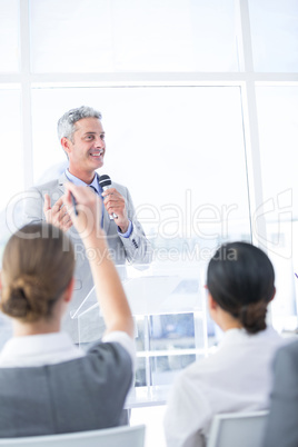 Businessman explaining the graph on the whiteboard