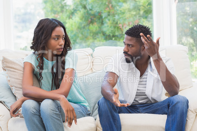 Couple having argument on the couch