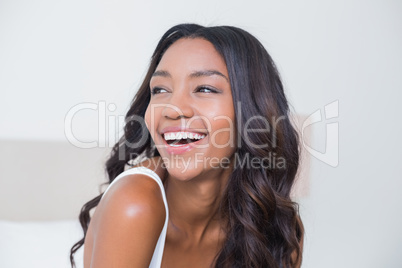 Beautiful woman smiling on bed