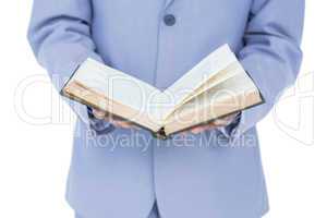 businessman holding a book