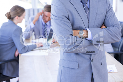 Colleagues with laptop and digital tablet in meeting