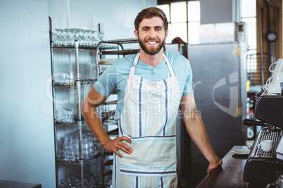 happy worker making coffee