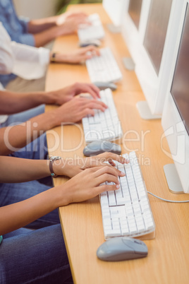 Business people typing on keyboard