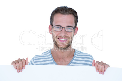 Happy handsome man holding blank paper