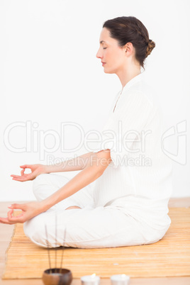 A woman in a meditation position