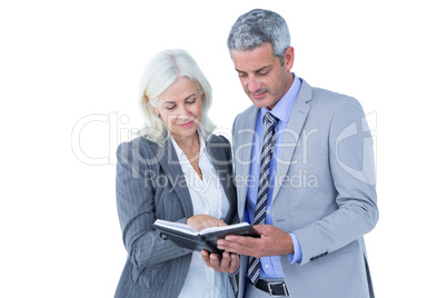 Smiling businesswoman and man with a notebook