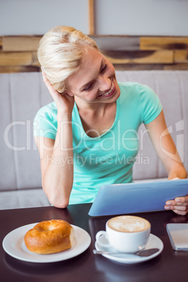 Pretty blonde using laptop computer