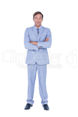 Portrait of a doubtful businessman with the arms crossed